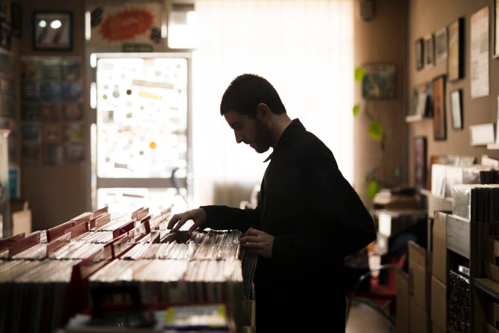 medium-shot-side-view-young-man-looking-vinyls-store-1024x683 The Mental Health of a Crime Writer: Managing Dark Themes